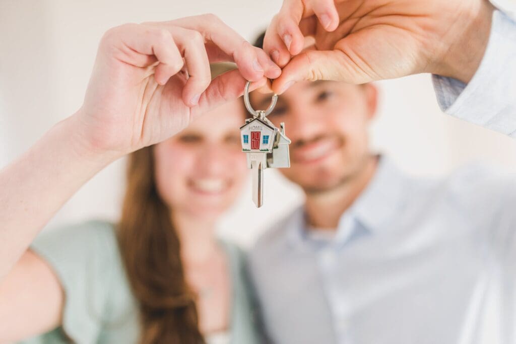Couple with keys to first home